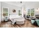 Bedroom features wood floors, sitting area, work space, and natural light from multiple windows at 2925 Old Broadnax Mill Rd, Loganville, GA 30052