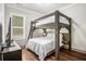 Bedroom with a large custom bunk bed, hardwood floors and natural light at 2925 Old Broadnax Mill Rd, Loganville, GA 30052