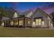 Inviting exterior of the home with a covered porch and ample seating area at 2925 Old Broadnax Mill Rd, Loganville, GA 30052
