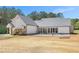 Expansive backyard of the home, featuring a covered porch and spacious outdoor seating area at 2925 Old Broadnax Mill Rd, Loganville, GA 30052