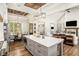 Well-equipped kitchen with island seating, premium appliances, and adjacent dining area creating a comfortable, open living space at 2925 Old Broadnax Mill Rd, Loganville, GA 30052