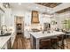 Beautiful kitchen with a spacious island, quartz countertops, and stainless steel appliances, seamlessly connecting to dining area at 2925 Old Broadnax Mill Rd, Loganville, GA 30052