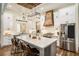 Modern farmhouse kitchen featuring a large island, stainless steel appliances, and custom cabinetry, perfect for cooking at 2925 Old Broadnax Mill Rd, Loganville, GA 30052