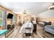 Living room with wood paneling, hardwood floors, a dining table, and a pullout sofa at 2925 Old Broadnax Mill Rd, Loganville, GA 30052