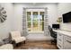 Well lit office featuring a large window and a desk with drawers at 2925 Old Broadnax Mill Rd, Loganville, GA 30052