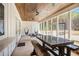 Covered patio featuring a rustic picnic table and hanging hammock chairs at 2925 Old Broadnax Mill Rd, Loganville, GA 30052
