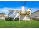 Exterior view of home's back deck overlooking the spacious lawn at 439 Wind Walk Cir, Lawrenceville, GA 30044