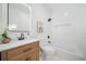 Charming bathroom featuring a wood vanity and shower-tub combination at 439 Wind Walk Cir, Lawrenceville, GA 30044