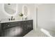 Bathroom featuring double sink vanity, modern black fixtures, and stunning light at 439 Wind Walk Cir, Lawrenceville, GA 30044