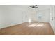 Bright, open bedroom with wood flooring, a ceiling fan and natural light at 439 Wind Walk Cir, Lawrenceville, GA 30044