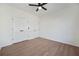 Light-filled bedroom with wood flooring and closet with modern black hardware at 439 Wind Walk Cir, Lawrenceville, GA 30044