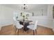 Stylish dining room features modern decor, light wood floors and seating for six at 439 Wind Walk Cir, Lawrenceville, GA 30044