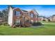 Charming two-story brick home with a well-manicured front lawn and an inviting front entrance at 439 Wind Walk Cir, Lawrenceville, GA 30044