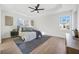 Main bedroom suite featuring tray ceiling, fan, and luxury decor at 439 Wind Walk Cir, Lawrenceville, GA 30044