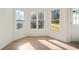 Bright sunroom with hardwood floors and large windows providing natural light at 439 Wind Walk Cir, Lawrenceville, GA 30044