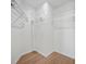 Empty walk-in closet with wood flooring and metal shelving at 439 Wind Walk Cir, Lawrenceville, GA 30044