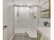 Stylish bathroom featuring a standing shower with a frameless glass door and neutral accents at 1135 Clairemont Ave # B, Decatur, GA 30030