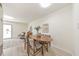 Bright dining area with a wooden table, comfortable chairs, and light-colored walls at 1135 Clairemont Ave # B, Decatur, GA 30030