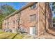 Multi-story brick apartment building showcasing symmetrical window and brick accents at 1135 Clairemont Ave # B, Decatur, GA 30030