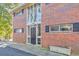 Charming red brick multi-Gathering home with black shutters and ample natural light through large windows at 1135 Clairemont Ave # B, Decatur, GA 30030