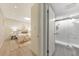 Bedroom leads to a full bathroom with tiled standing shower and frameless glass door at 1135 Clairemont Ave # B, Decatur, GA 30030