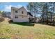 Two-story home with a deck and spacious backyard featuring mature trees at 4150 Soaring Dr, Douglasville, GA 30135