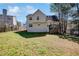 Backyard view of two-story home with a deck and plenty of green space at 4150 Soaring Dr, Douglasville, GA 30135