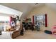 Spacious bonus room with sloped ceilings, natural light, and versatile layout for a home office at 4150 Soaring Dr, Douglasville, GA 30135