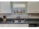 Close up of a kitchen featuring stainless steel appliances, countertops and window at 4150 Soaring Dr, Douglasville, GA 30135