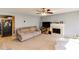 Open living room with a fireplace, adjoining kitchen, and comfortable seating at 4150 Soaring Dr, Douglasville, GA 30135