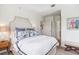 Well-lit bedroom featuring a large bed, two lamps, and white walls at 50 Biscayne Nw Dr # 6117, Atlanta, GA 30309