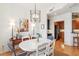 Dining room featuring natural light, chandelier, and open access to the kitchen at 50 Biscayne Nw Dr # 6117, Atlanta, GA 30309