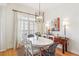 Dining room featuring natural light, elegant chandelier, and seating for six at 50 Biscayne Nw Dr # 6117, Atlanta, GA 30309