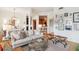 Bright living room features neutral decor, art gallery and stylish furniture at 50 Biscayne Nw Dr # 6117, Atlanta, GA 30309