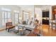 Bright living room features neutral decor, shutters, and a glass coffee table at 50 Biscayne Nw Dr # 6117, Atlanta, GA 30309