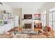 Living room featuring a fireplace, TV, and art gallery with access to a closet at 50 Biscayne Nw Dr # 6117, Atlanta, GA 30309