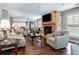 Inviting living room with hardwood floors, stone fireplace, and ample seating at 50 Biscayne Nw Dr # 6117, Atlanta, GA 30309