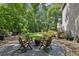 Inviting backyard with a gravel fire pit area, comfortable seating, and mature trees providing ample shade at 750 Crest Valley Nw Dr, Sandy Springs, GA 30327