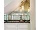 Modern bar area with glass shelves and lighting at 750 Crest Valley Nw Dr, Sandy Springs, GA 30327