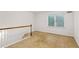 This bedroom has carpet, white paint, trim and a large window at 750 Crest Valley Nw Dr, Sandy Springs, GA 30327