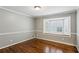 Cozy bedroom with a bay window, hardwood floors, and neutral wall color at 750 Crest Valley Nw Dr, Sandy Springs, GA 30327
