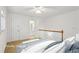 Bright, staged bedroom with carpet leading to bathroom at 750 Crest Valley Nw Dr, Sandy Springs, GA 30327