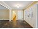 Spacious foyer with stone flooring, white trim, and natural light from a multi-pane front door at 750 Crest Valley Nw Dr, Sandy Springs, GA 30327