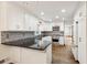 Kitchen with white cabinets, stainless steel appliances, and dark countertops at 750 Crest Valley Nw Dr, Sandy Springs, GA 30327