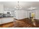 Open-concept kitchen and living room with hardwood flooring at 750 Crest Valley Nw Dr, Sandy Springs, GA 30327