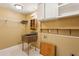 Laundry room featuring shelves, cabinets, and a sink at 750 Crest Valley Nw Dr, Sandy Springs, GA 30327