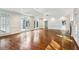 Living room with hardwood flooring and many arched windows at 750 Crest Valley Nw Dr, Sandy Springs, GA 30327