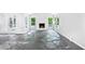 Bright living room with a stone tile floor and stone fireplace at 750 Crest Valley Nw Dr, Sandy Springs, GA 30327