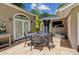 Backyard patio featuring outdoor seating and a TV at 750 Crest Valley Nw Dr, Sandy Springs, GA 30327