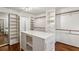 Bright walk-in closet offering custom storage solutions, including shelving and drawers at 750 Crest Valley Nw Dr, Sandy Springs, GA 30327